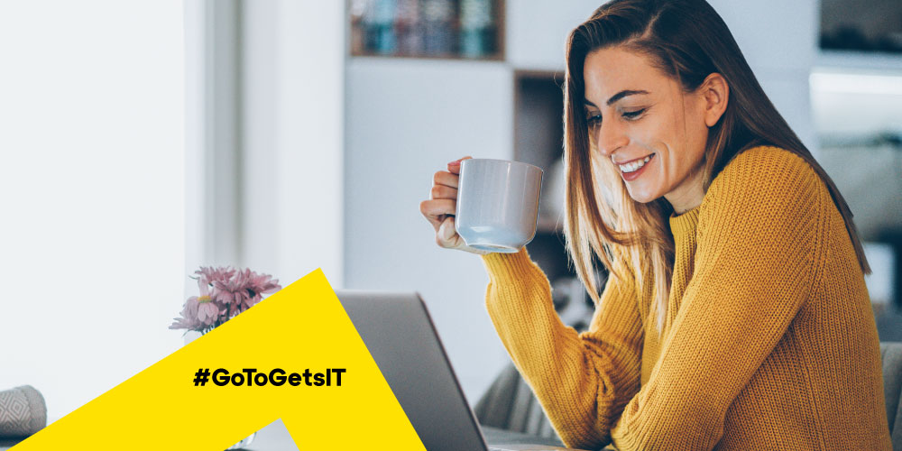 Woman working remotely with a laptop and coffee with better PC performance by reducing RAM usage