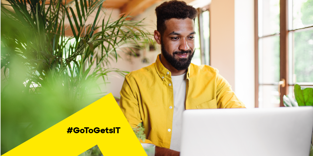 Man working in a light-filled room considering RMM and PSA software for his MSP business