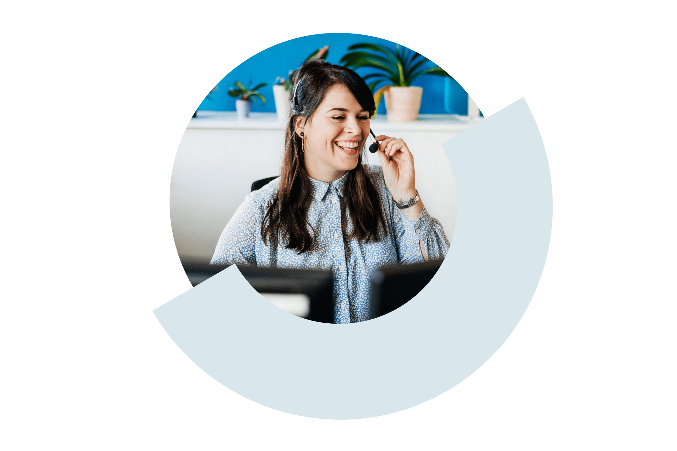 A smiling customer service representative wearing a headset, engaging with a customer.