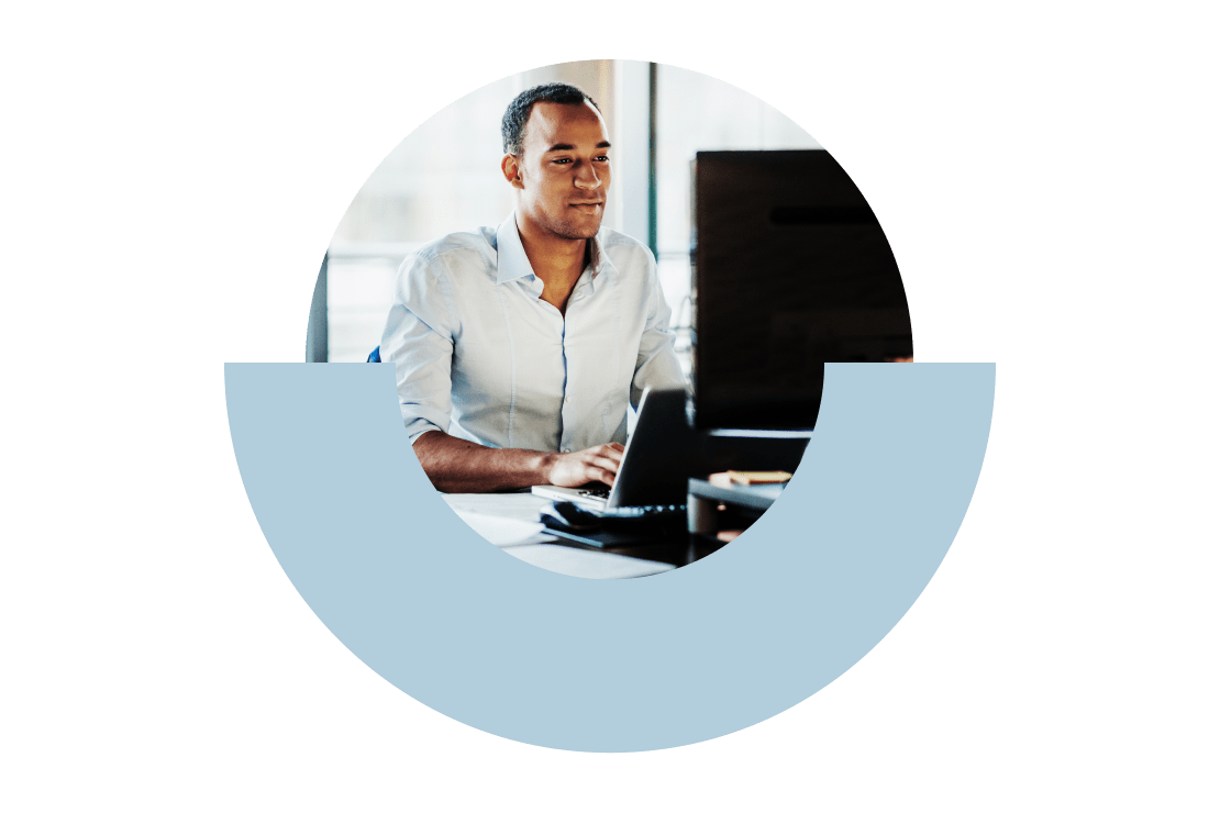 Professional using the GoTo app in their home office on their compatible desk-phone.