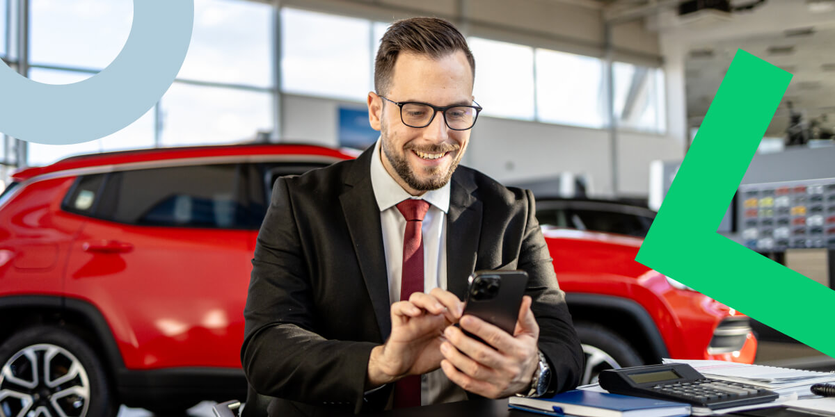 Car salesman using GoTo Connect to effectively communicate with customers.